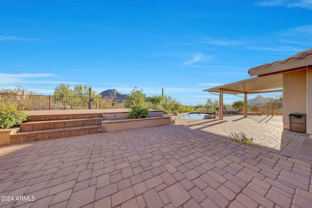 view of patio / terrace with a mountain view