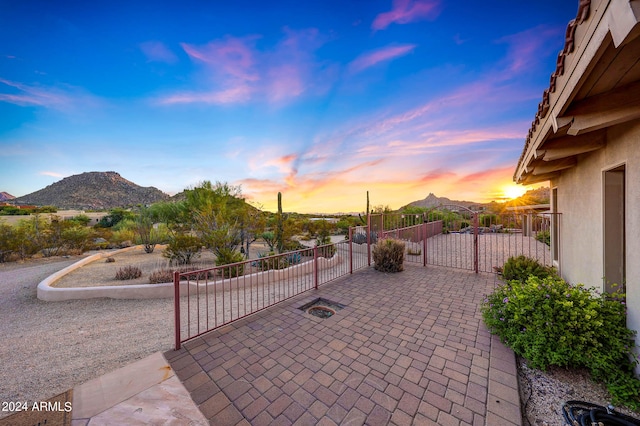 patio terrace at dusk with a mountain view