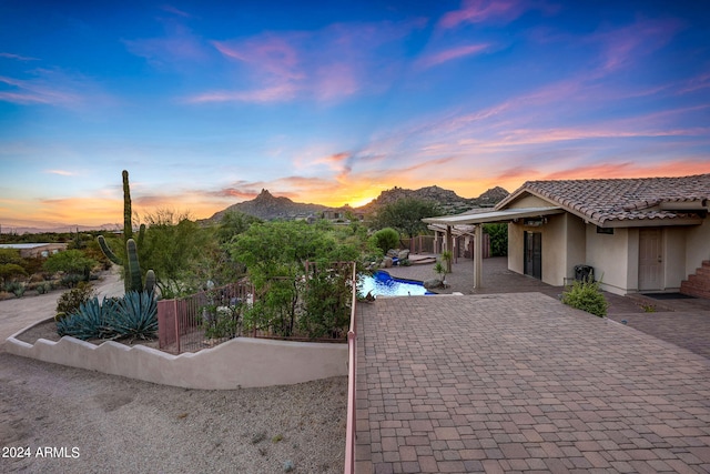 patio terrace at dusk with a mountain view