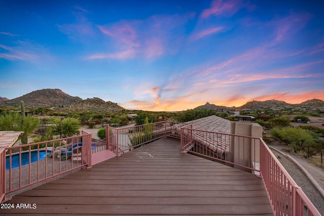 deck at dusk with a mountain view