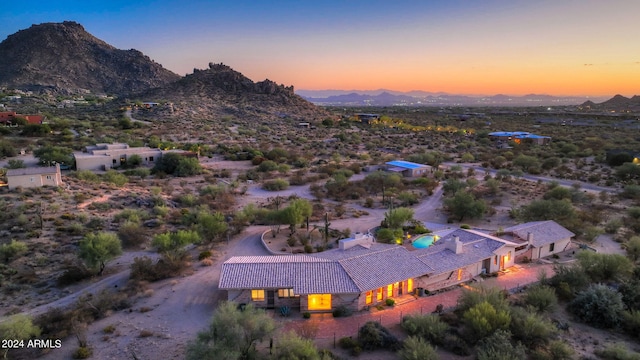 aerial view at dusk with a mountain view