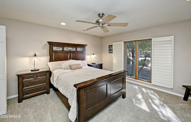 bedroom featuring ceiling fan and light colored carpet