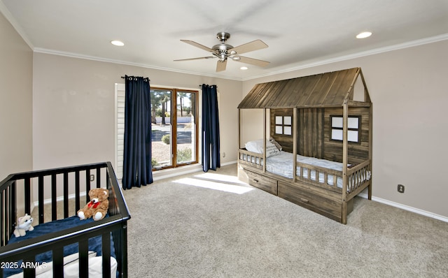 carpeted bedroom featuring ornamental molding and ceiling fan