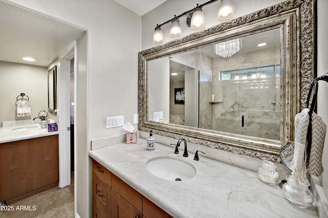 bathroom featuring vanity and a shower with shower door