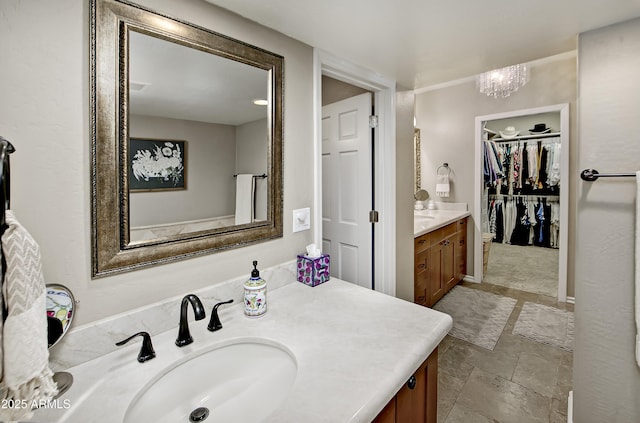 bathroom with vanity and a notable chandelier