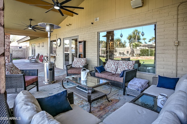 view of patio featuring ceiling fan and an outdoor living space