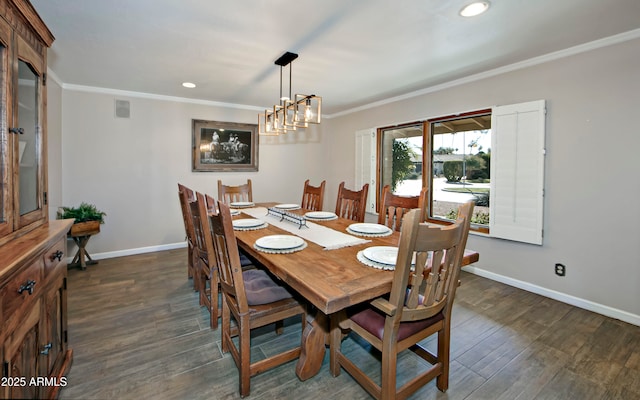 dining space with ornamental molding, dark wood-type flooring, and a chandelier