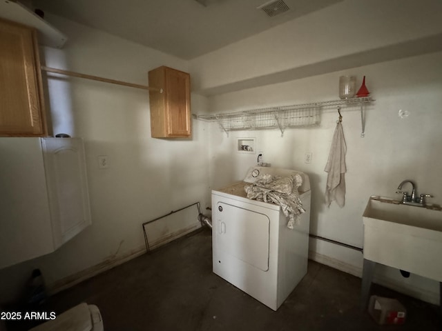 clothes washing area with washer / clothes dryer and sink