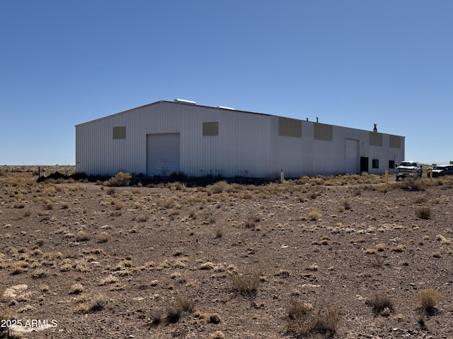 view of side of property featuring an outdoor structure