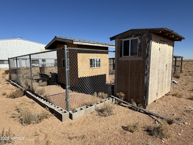 view of property exterior featuring an outbuilding