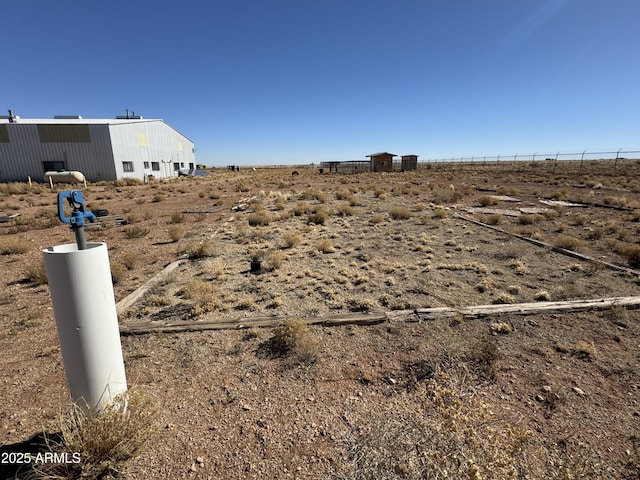 view of yard with a rural view