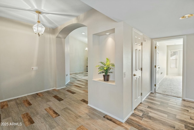 hallway with light wood-type flooring