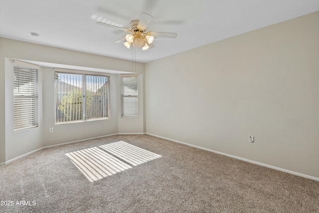 unfurnished room with carpet floors and ceiling fan