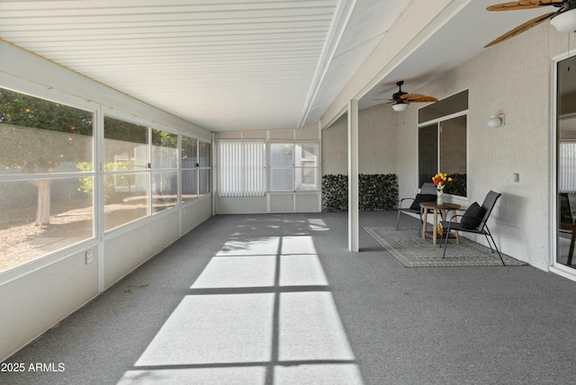 sunroom with ceiling fan