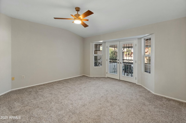 spare room featuring ceiling fan, lofted ceiling, french doors, and carpet flooring