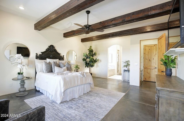 bedroom featuring beamed ceiling, ensuite bath, and ceiling fan