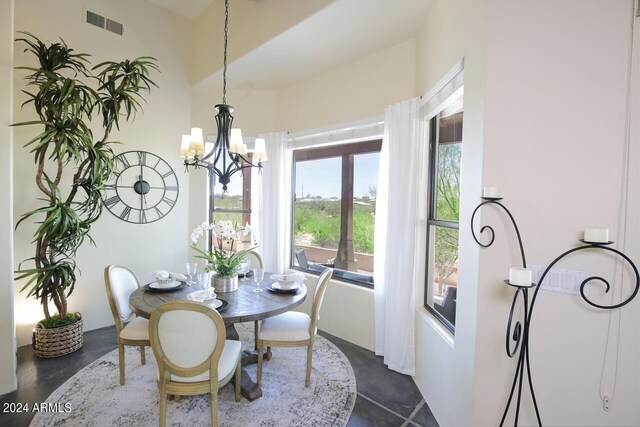 dining space with a notable chandelier