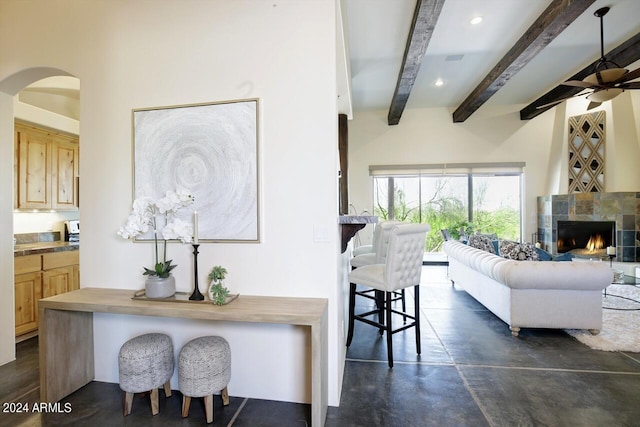 interior space with a fireplace and beam ceiling