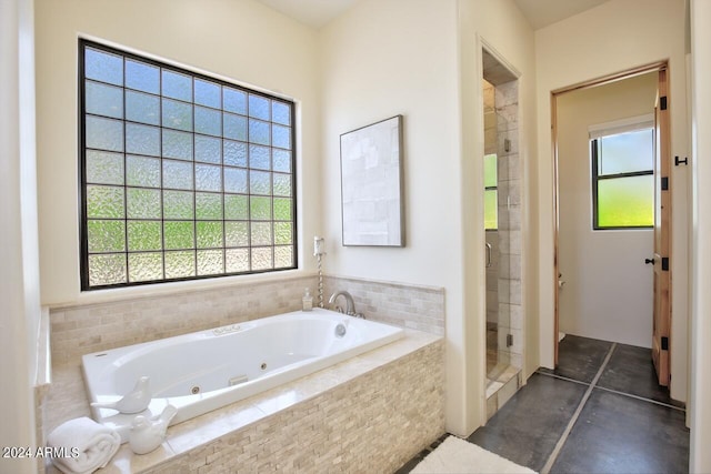 bathroom with shower with separate bathtub