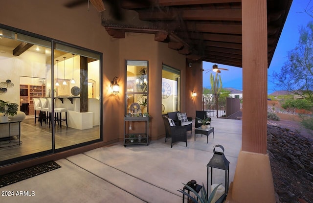 view of patio terrace at dusk