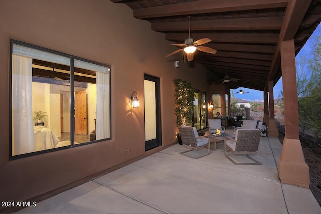 view of patio featuring ceiling fan and an outdoor living space