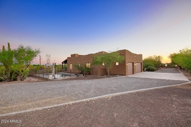 southwest-style home featuring a garage