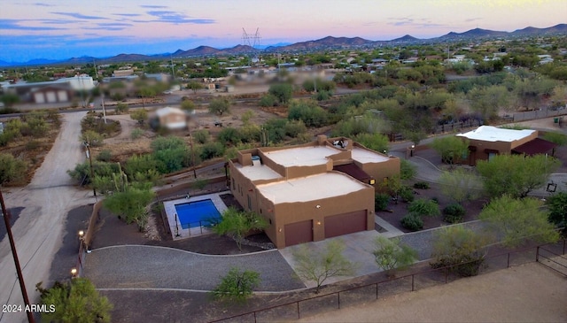 aerial view at dusk with a mountain view