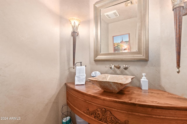 bathroom with vanity with extensive cabinet space