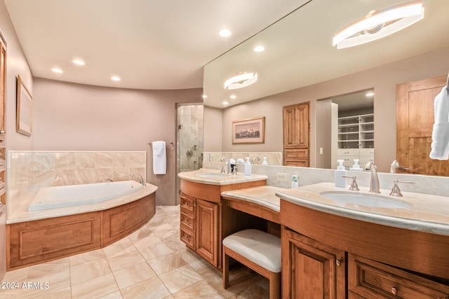 bathroom with a bathing tub, tile flooring, and dual bowl vanity