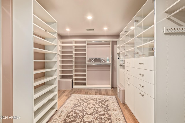 walk in closet featuring light hardwood / wood-style floors