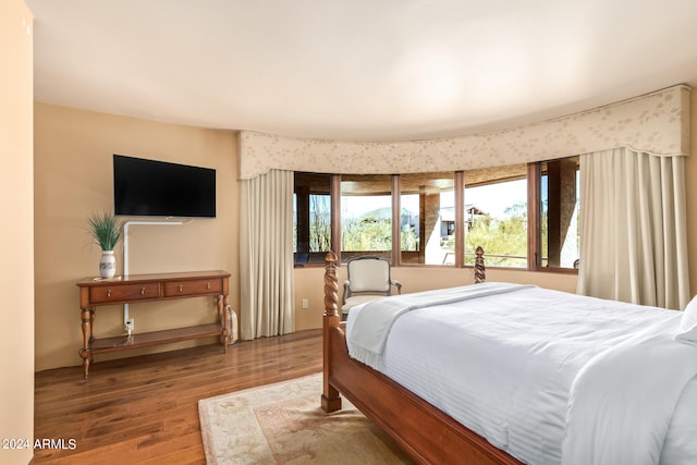 bedroom with hardwood / wood-style floors