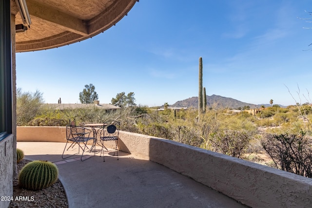 view of patio / terrace with a mountain view