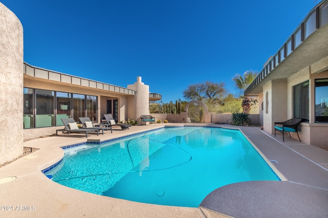 view of swimming pool featuring a patio area