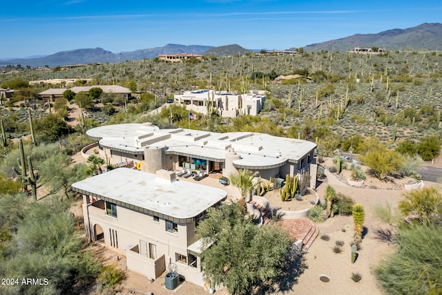 birds eye view of property with a mountain view