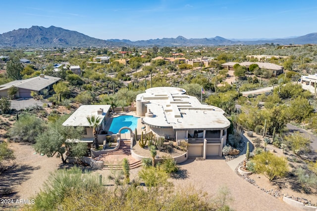 birds eye view of property featuring a mountain view