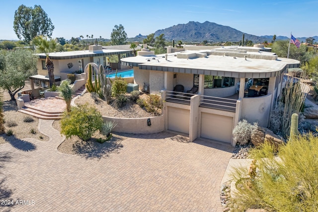 view of front of house featuring a patio area and a mountain view