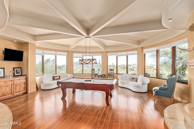 rec room with hardwood / wood-style floors, beam ceiling, pool table, and plenty of natural light