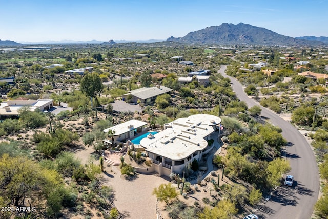 birds eye view of property with a mountain view