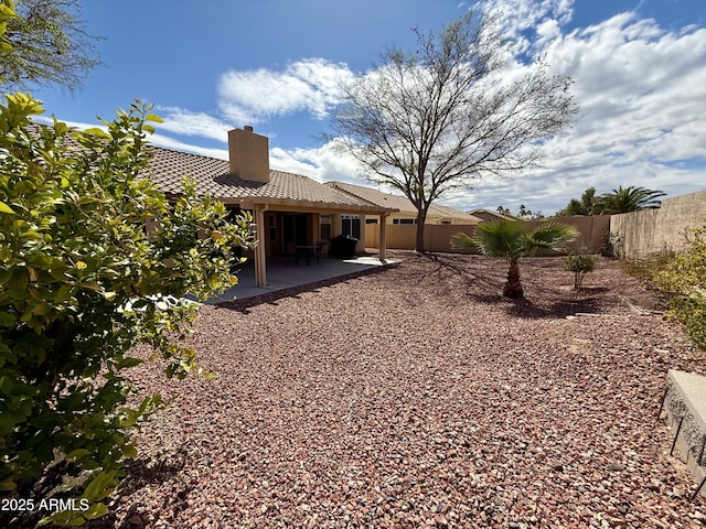 view of yard featuring a fenced backyard and a patio