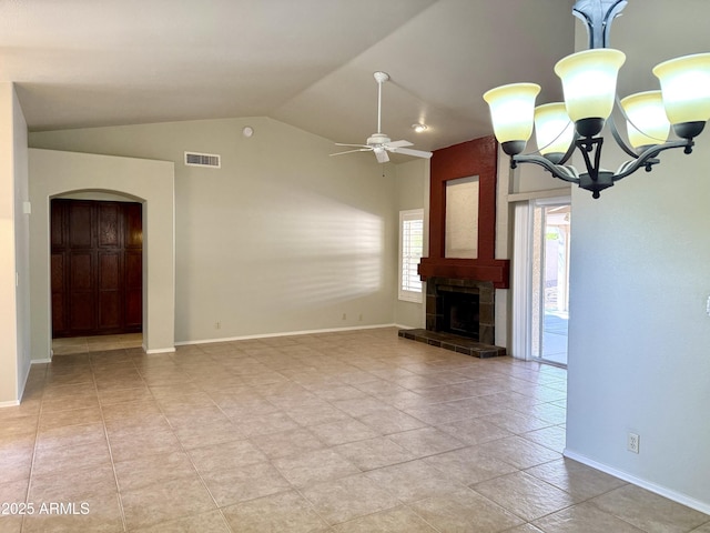 unfurnished living room featuring visible vents, lofted ceiling, a fireplace, arched walkways, and ceiling fan with notable chandelier