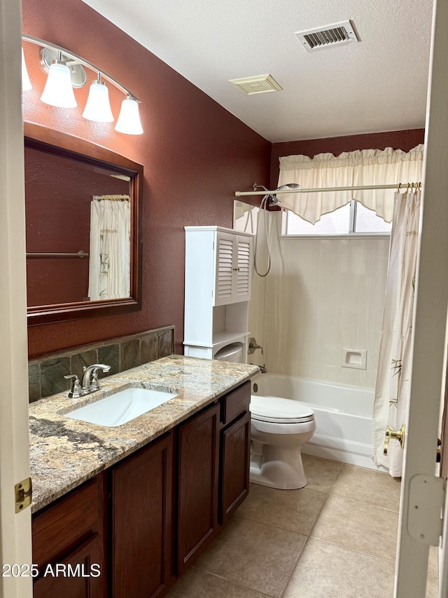 bathroom featuring vanity, visible vents, shower / bath combo, a textured ceiling, and toilet