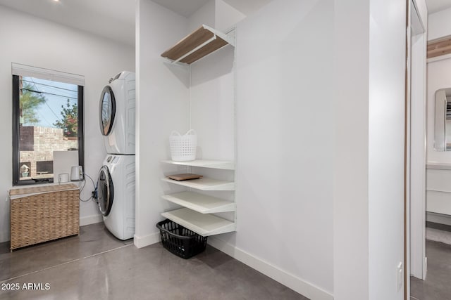 laundry area with stacked washer and dryer