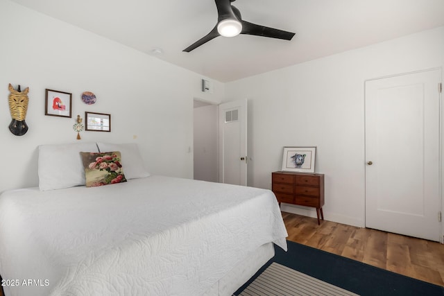 bedroom featuring hardwood / wood-style flooring and ceiling fan