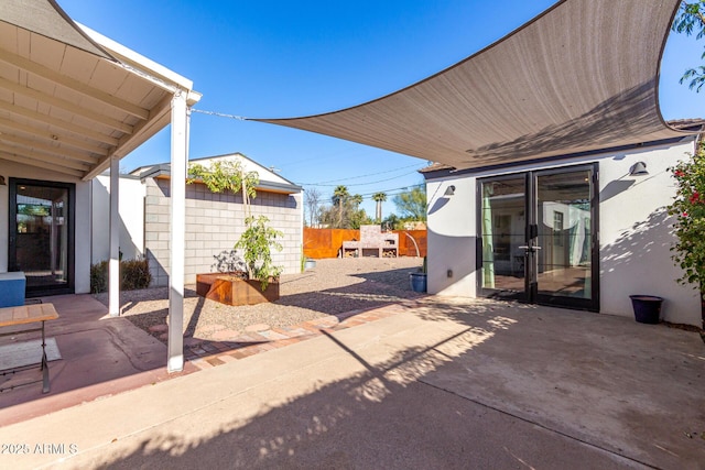 view of patio featuring a shed