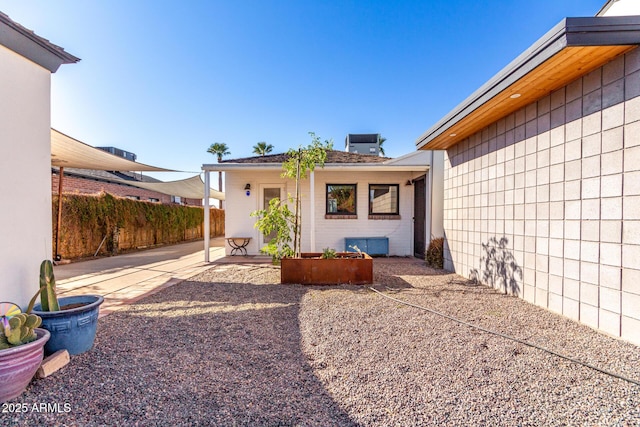 back of house featuring a patio