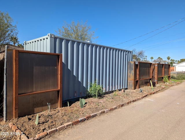 view of side of property with an outbuilding