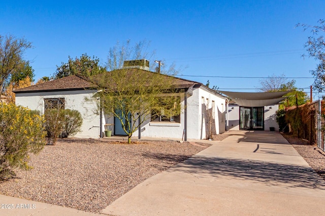 view of front of home featuring a carport