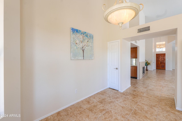 interior space featuring tile flooring and a high ceiling