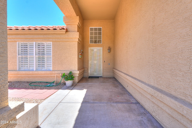 doorway to property featuring a patio