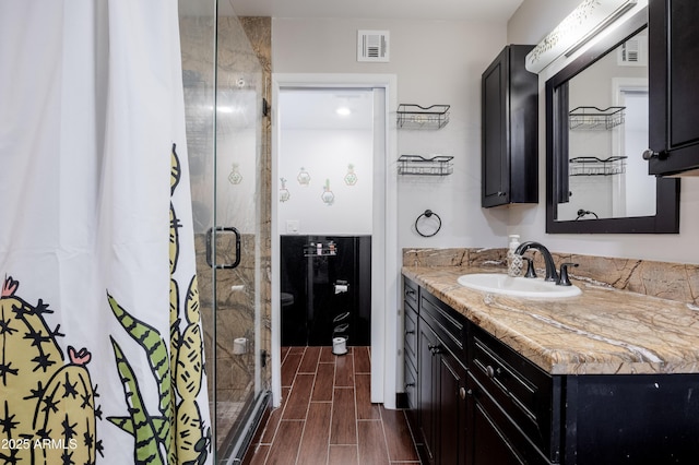 1551 E Glencove St, Mesa, AZ 85203 - full bath with vanity, a stall shower, and wood tiled floors